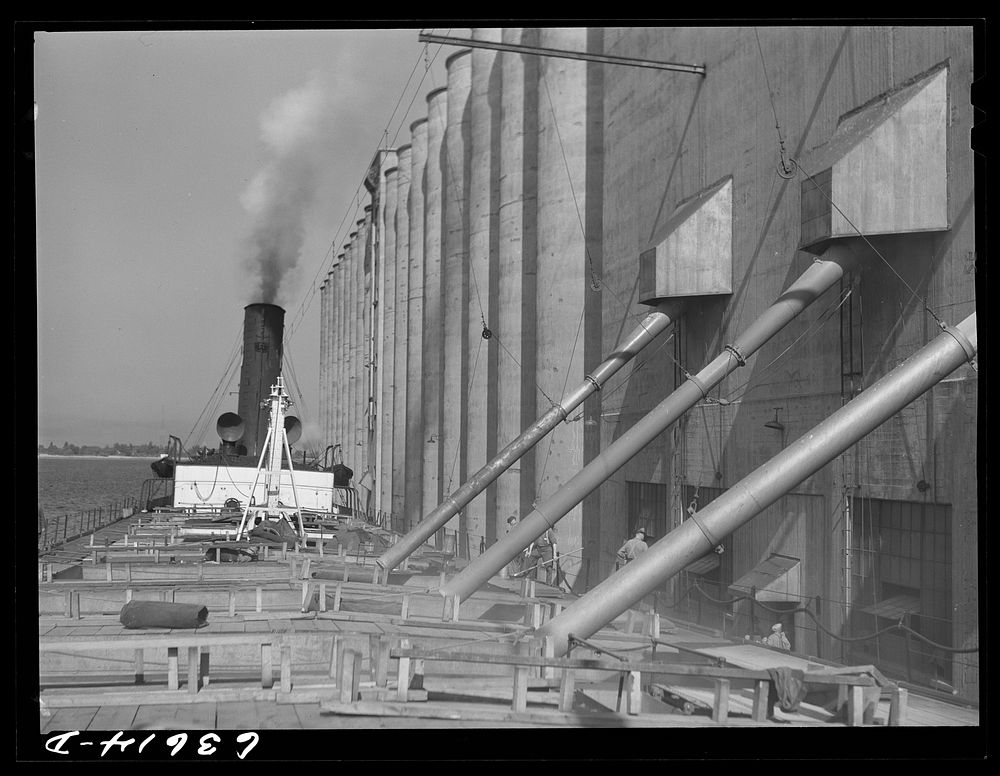 [Untitled photo, possibly related to: Loading the James Watt with wheat. Elevator "E". Duluth, Minnesota]. Sourced from the…