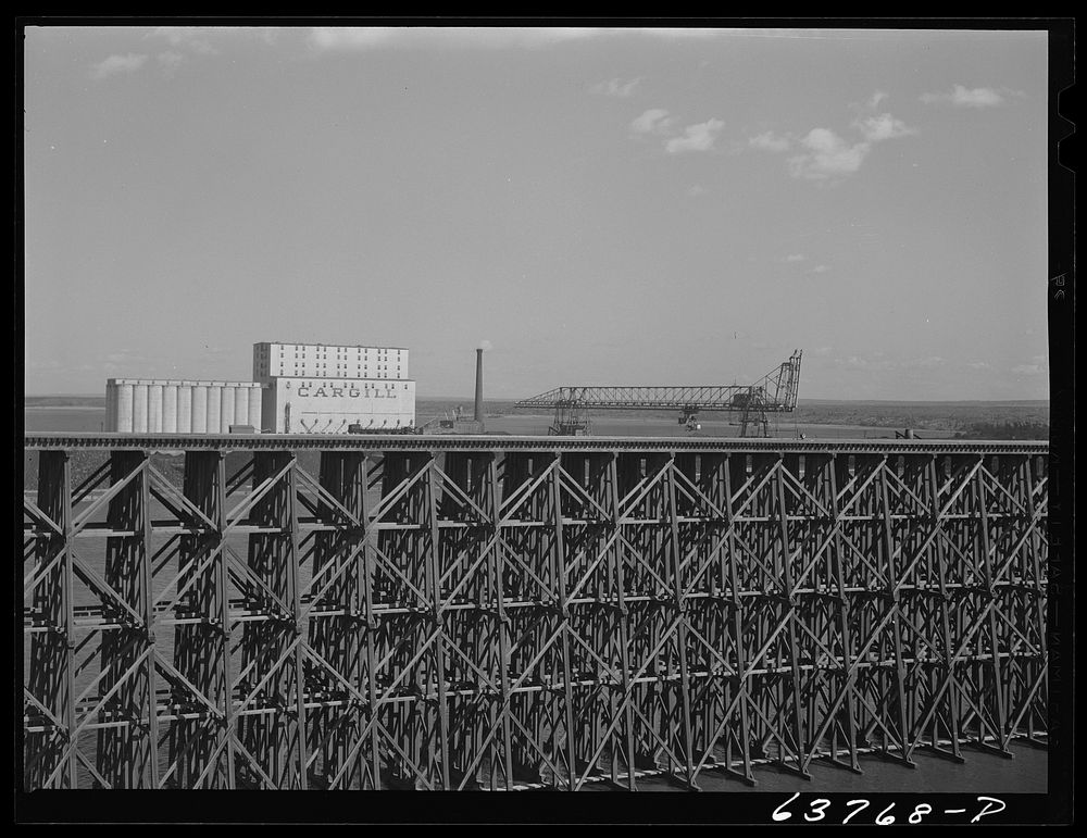 Iron ore dock. Grain elevator and coal loading docks in background. Allouez, Wisconsin. Sourced from the Library of Congress.