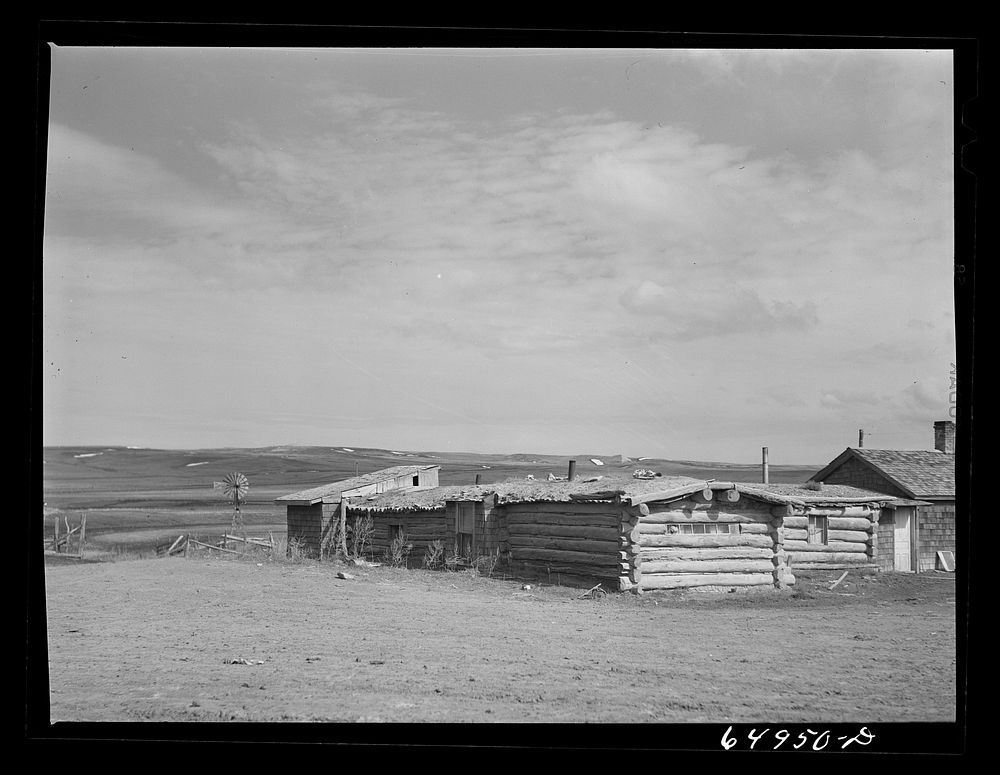 Sand Springs, Montana. Log buildings, a general store and post office in Garfield County. Sourced from the Library of…