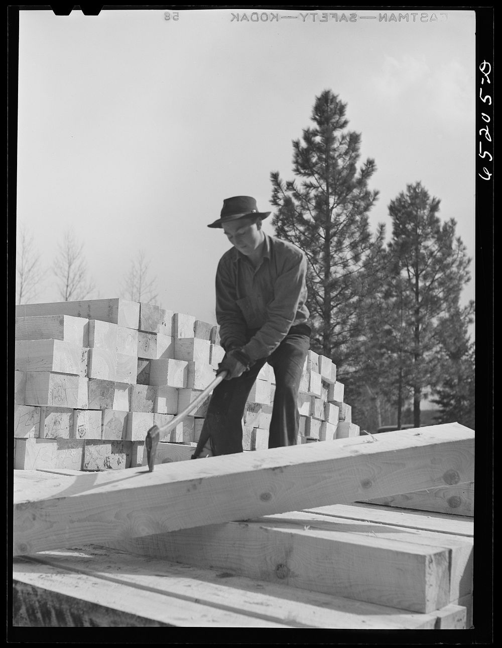 [Untitled photo, possibly related to: Kalispell, Montana. Flathead Valley special area project. Stacking railroad ties at…