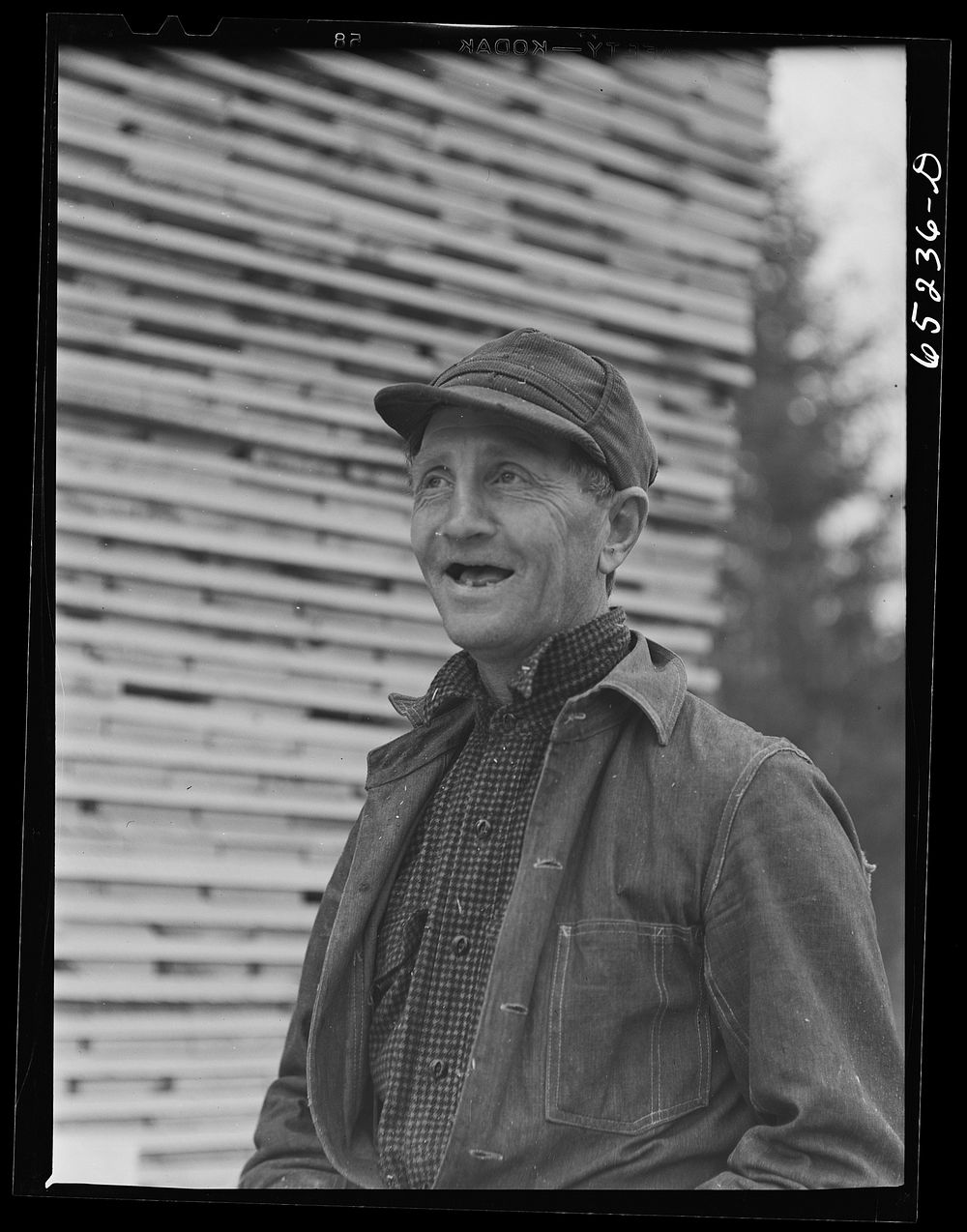[Untitled photo, possibly related to: Flathead Valley special area project, Montana. Stacking board lumber at the…