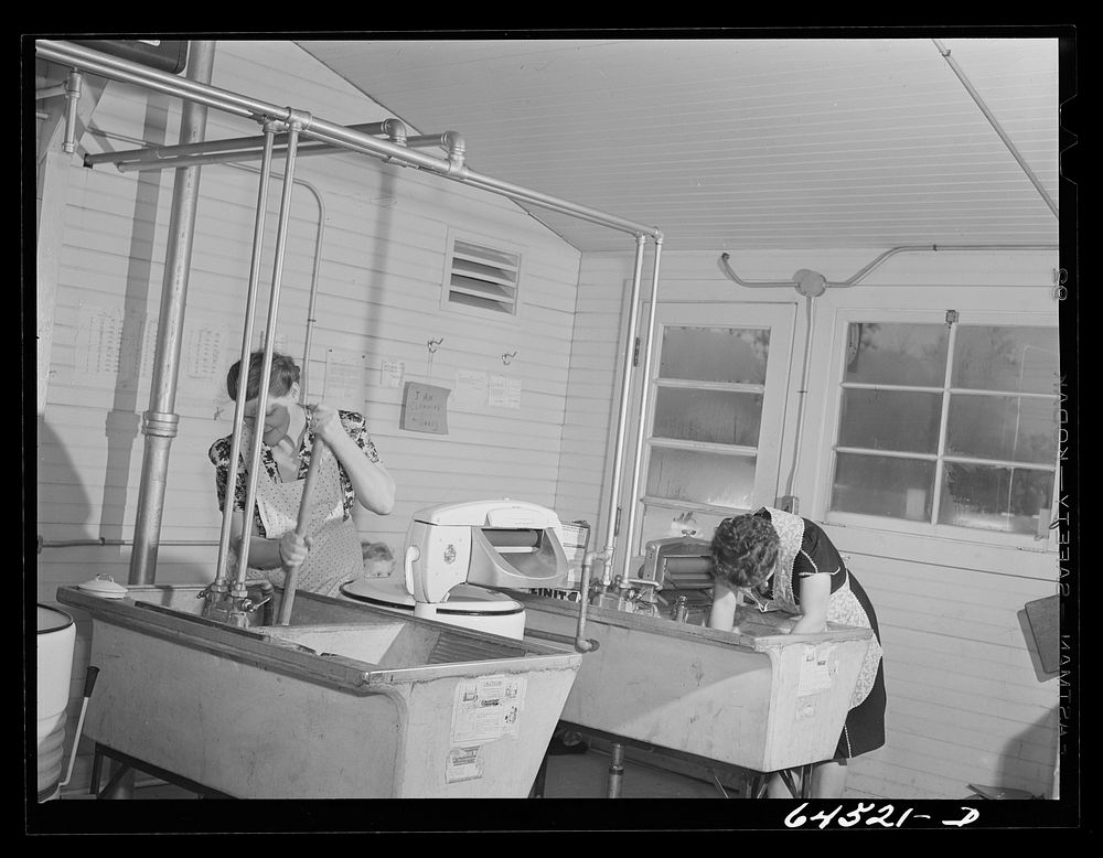 Burlington, Iowa. Acres unit, FSA (Farm Security Administration) trailer camp. In the utility building for workers at…