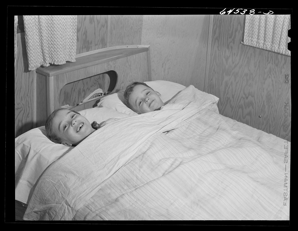 Burlington, Iowa. Acres unit, FSA (Farm Security Administration) trailer camp. Cecil Patrick's kids in bed in their trailer…