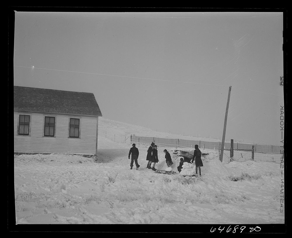 Morton County, North Dakota. Building snow fort at noon recess at a rural school. Sourced from the Library of Congress.