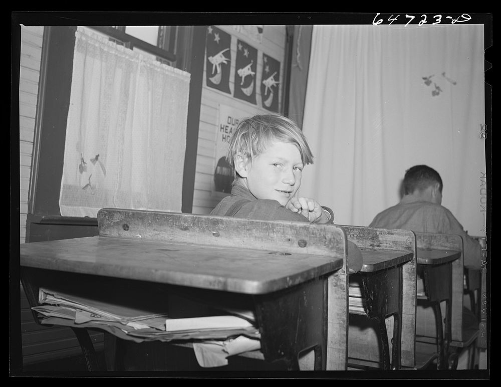[Untitled photo, possibly related to: Morton County, North Dakota. Farm boy with his geography book]. Sourced from the…