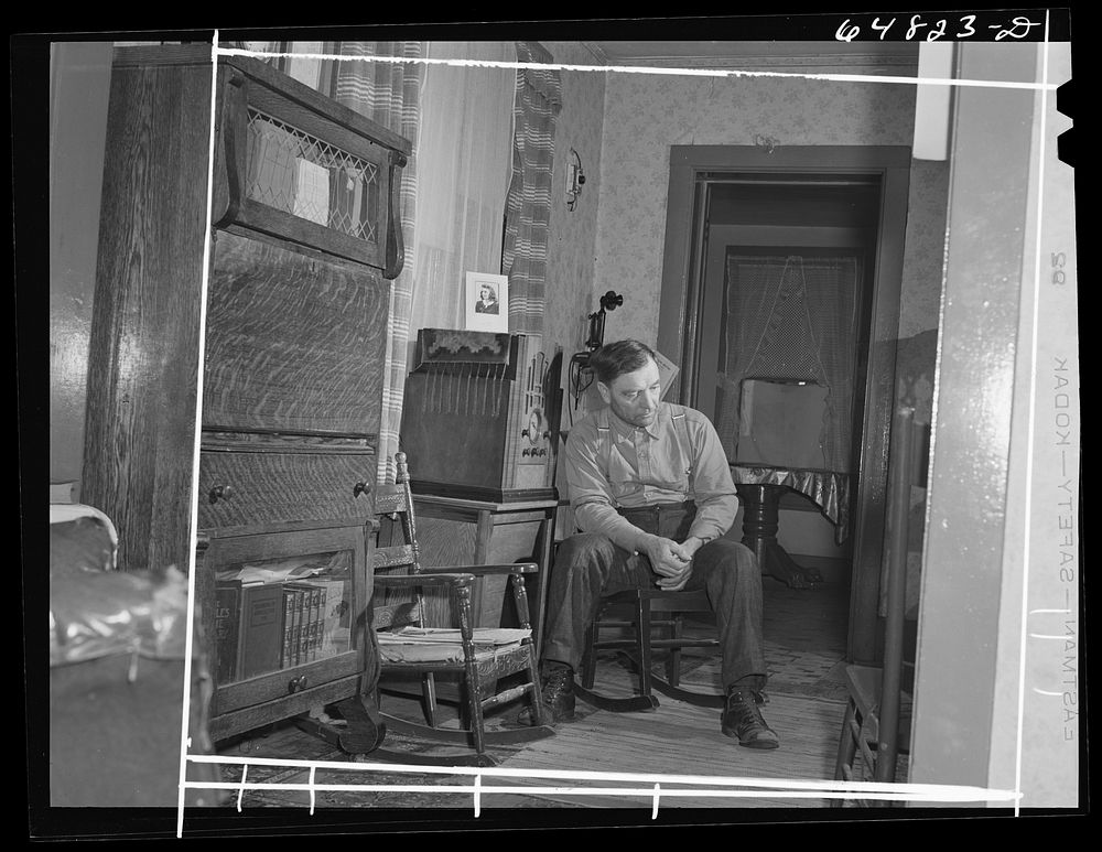 Adams County, North Dakota. North Dakota stock farmer, George P. Moeller, listening to war news on the radio. Sourced from…