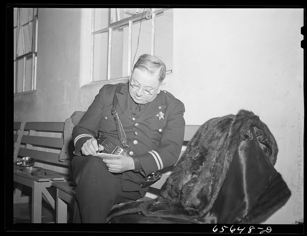Idaho Falls, Idaho. Policeman registering in Selective Service registration for men forty-five to sixty-five. Sourced from…