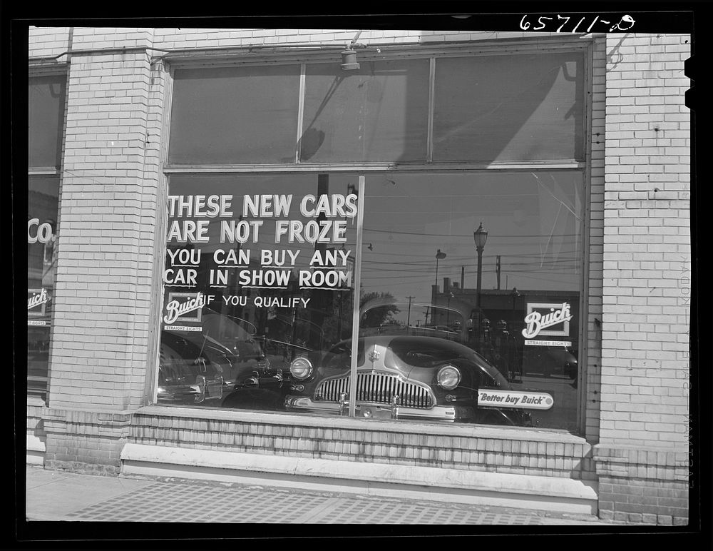 Grand Island, Nebraska. Auto dealer's window. Sourced from the Library of Congress.