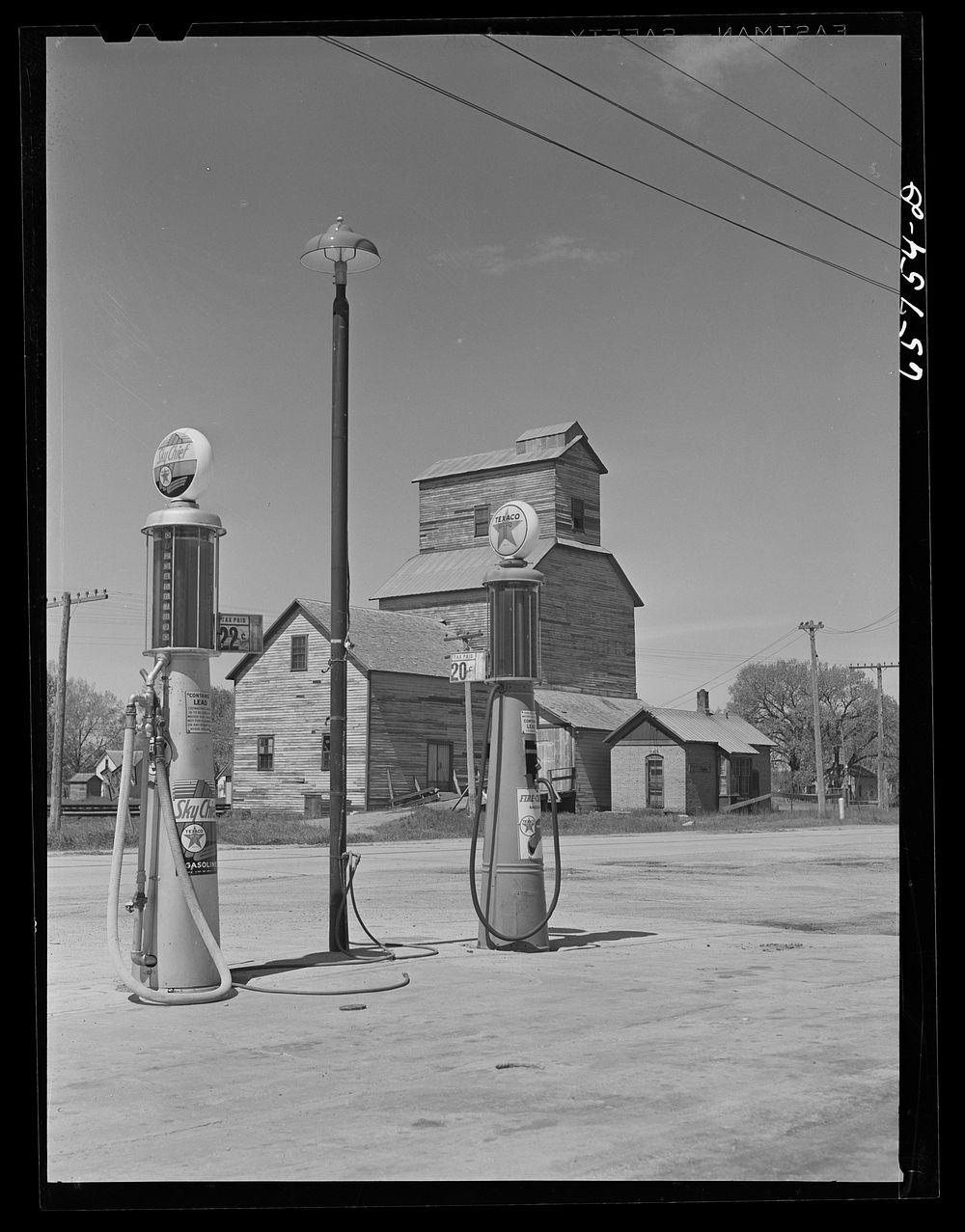 Gothenburg, Nebraska. Gas station and grain elevator. Sourced from the Library of Congress.