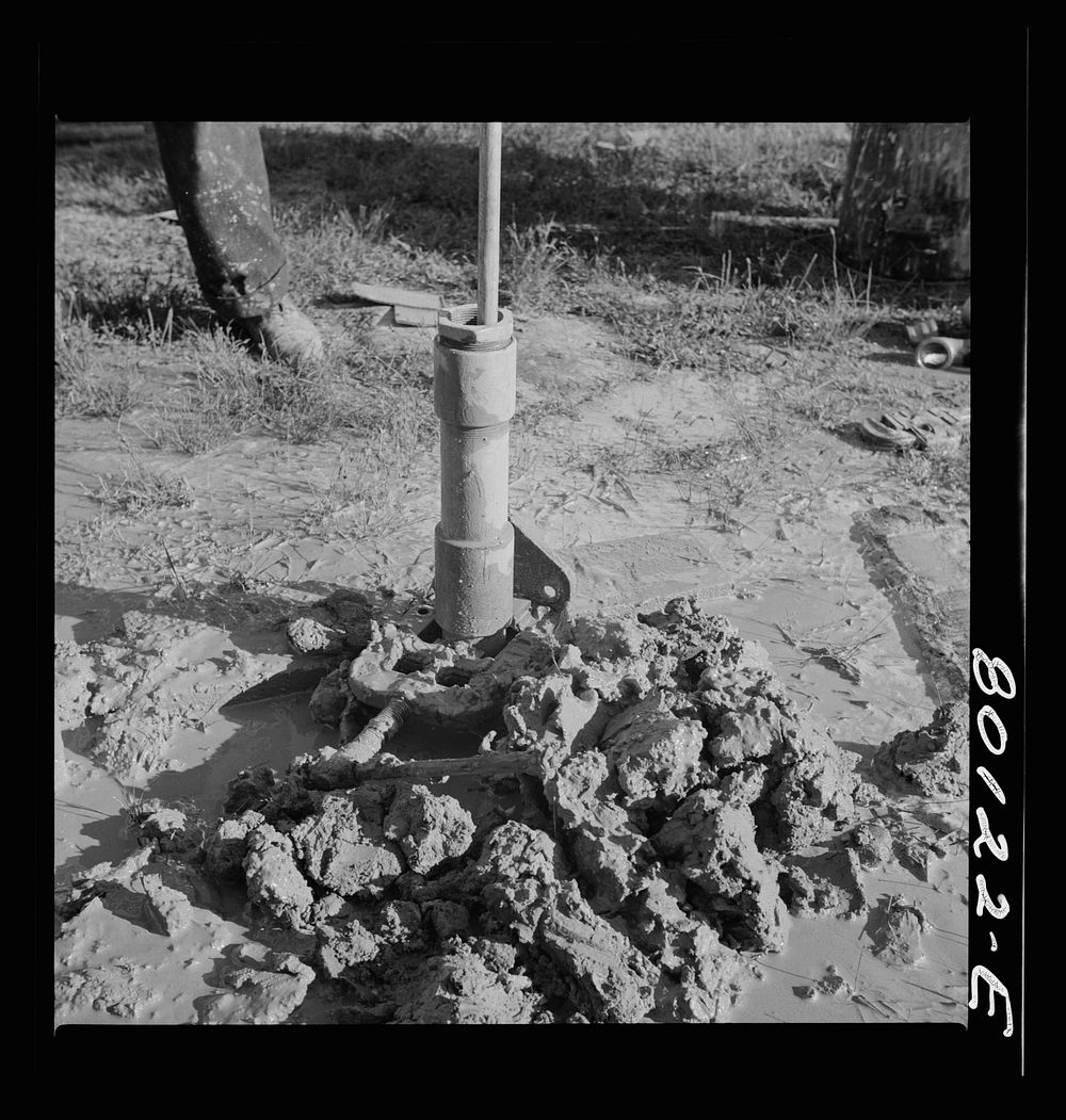 Casing and pump rod before the final filling with sand and gravel. Ridge well project, St. Marys County, Maryland. Sourced…