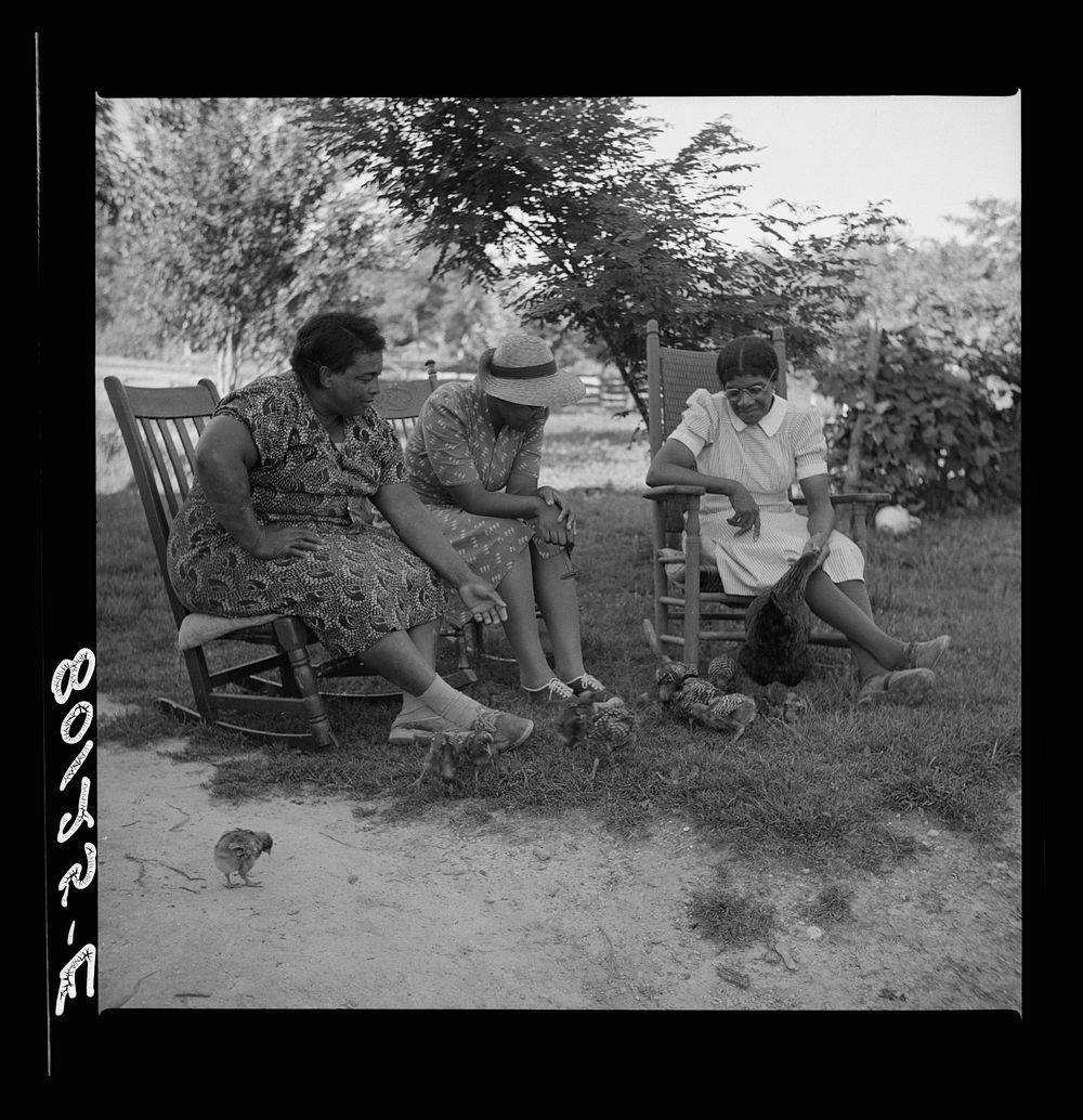 Two  supervisors and borrower talk over the home problem. Saint Mary's County, Maryland. Sourced from the Library of…