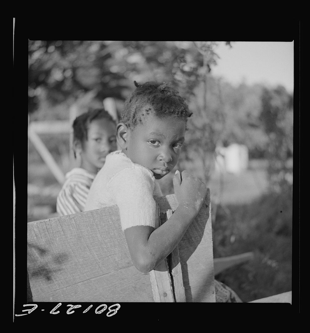 This little  girl was suspicious of the whole proceedings. Saint Mary's County, Maryland. Ridge well project. Sourced from…