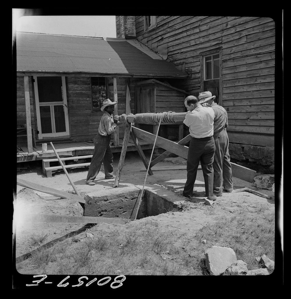 [Untitled photo, possibly related to: Windlass lifts cement wall from well. John Hardesty well project, Charles County…