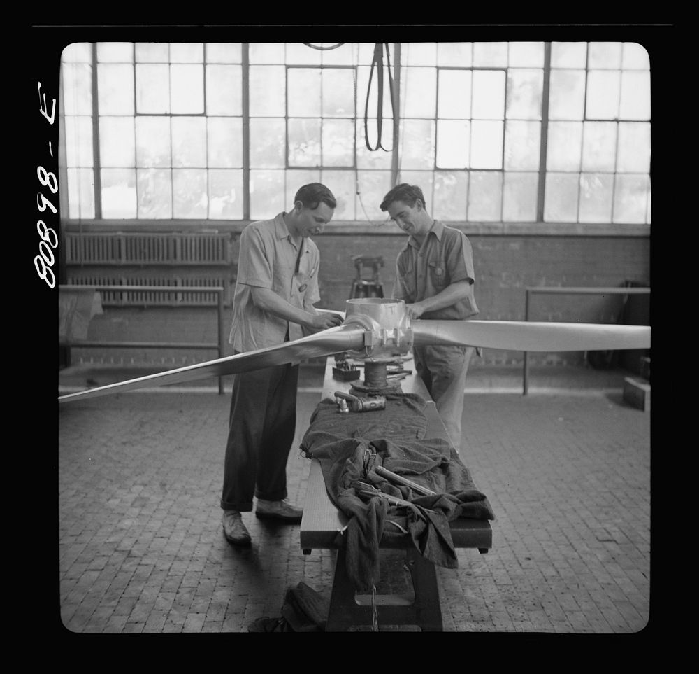 Final adjustment on finished propeller. Hamilton propeller plant, East Hartford, Connecticut. Sourced from the Library of…