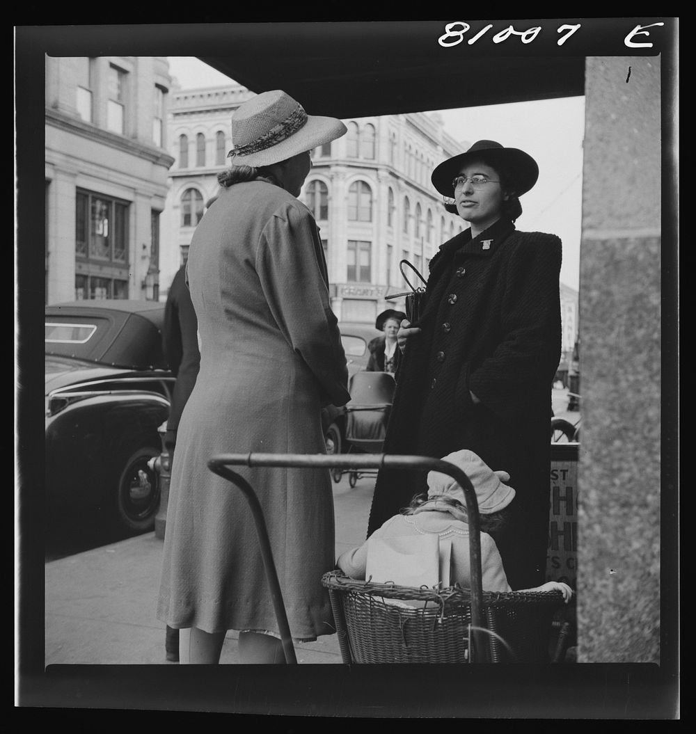 Women talk. Street scene at Holyoke, Massachusetts. Sourced from the Library of Congress.