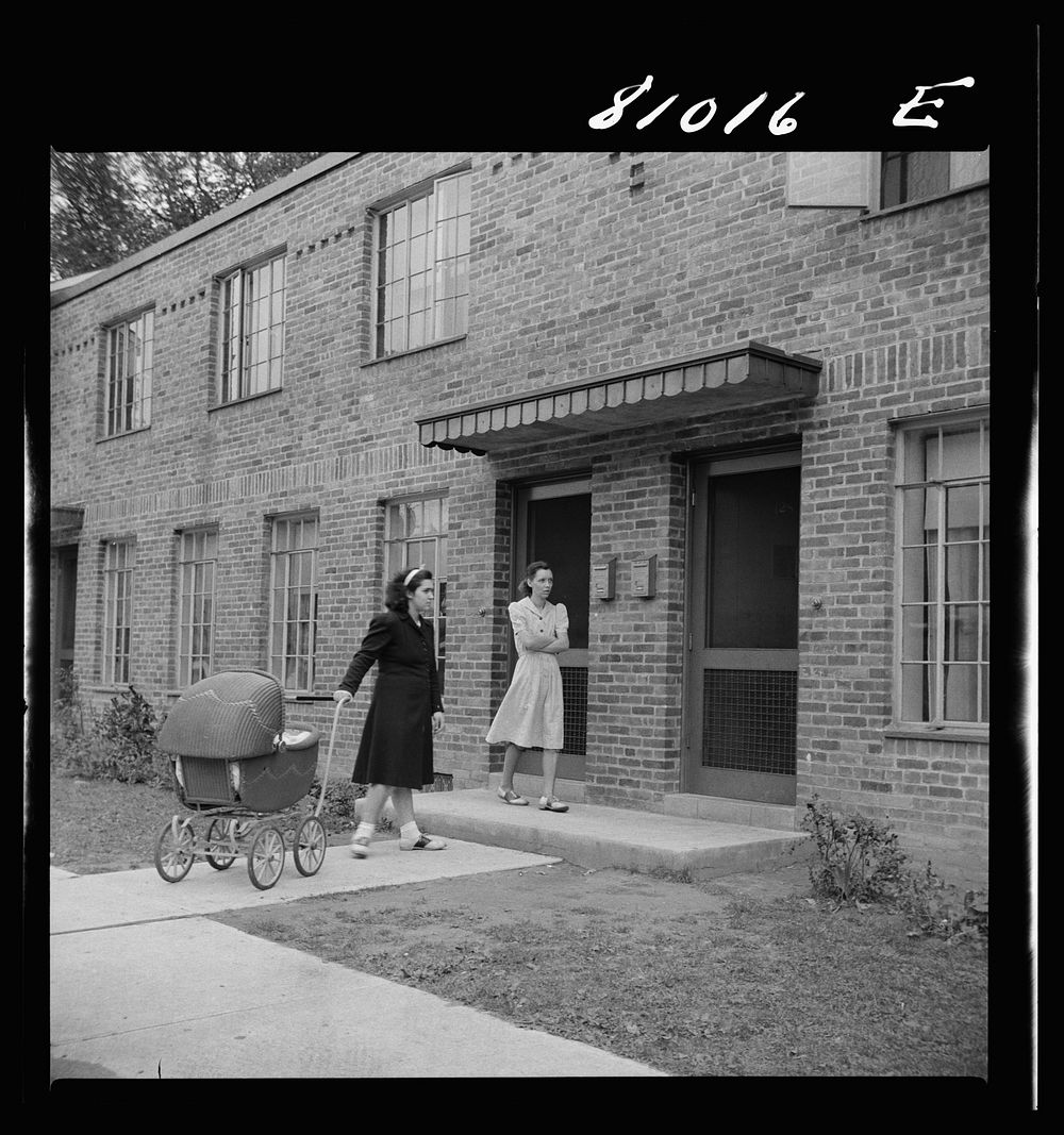 Holyoke, Massachusetts. Two women on one of the streets of the low income housing project of the FHA Federal Housing…