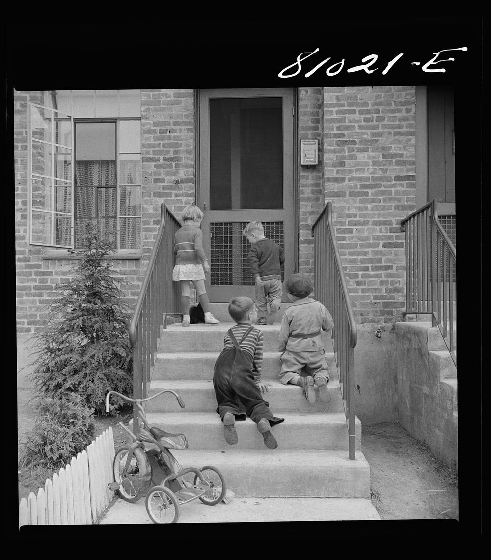 Children play in safety in the FHA (Federal Housing Administration) low income housing project at Holyoke, Massachusetts.…