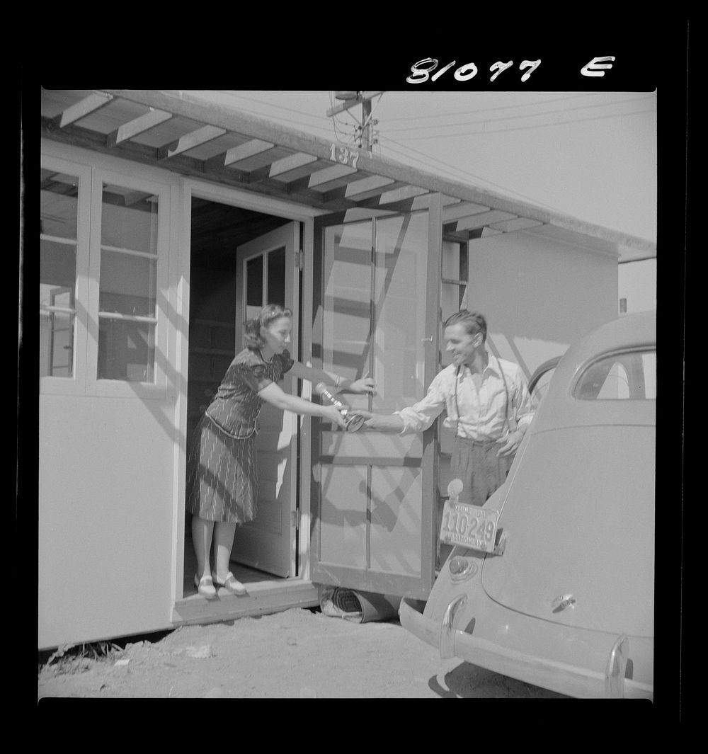 [Untitled photo, possibly related to: Between shifts at defense plant this FSA (Farm Security Administration) tenant moves…