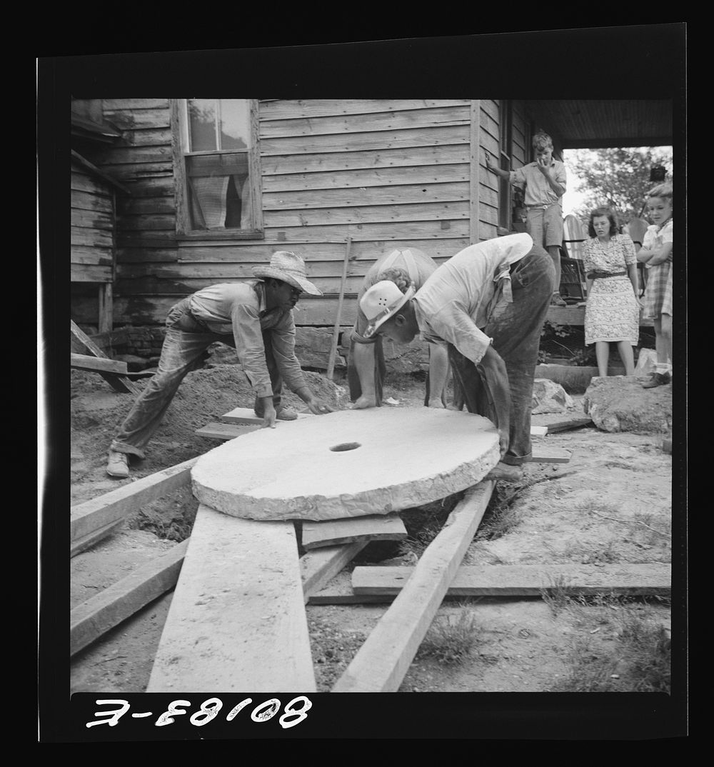Sliding the present concrete slab to the well opening. Safe well demonstration near La Plata, Maryland. Charles County.…