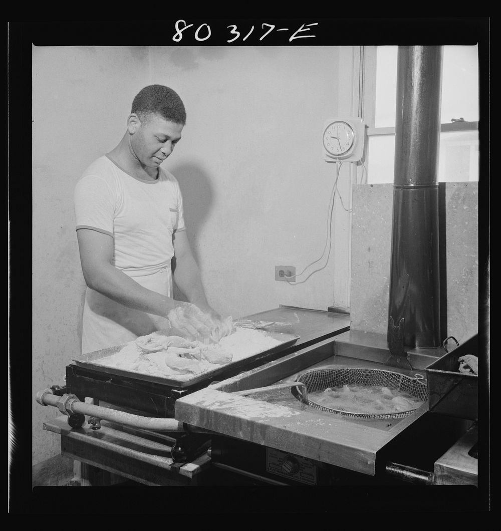 Craig Field cooks worked all morning preparing a feast of FSA (Farm Security Administration) "Food for Defense" chickens for…
