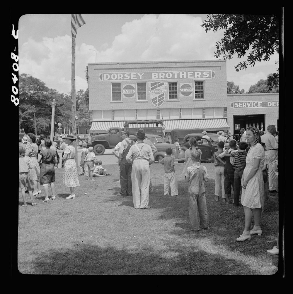 Everyone turned out to give the boys a cheer. Home guard passes through Enterprise, Coffee County, Alabama. Sourced from the…