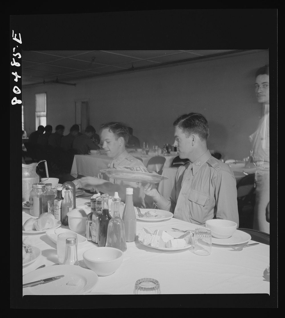 [Untitled photo, possibly related to: "Like real home-cooked chicken" say these Craig Field flying cadets, in praise of the…