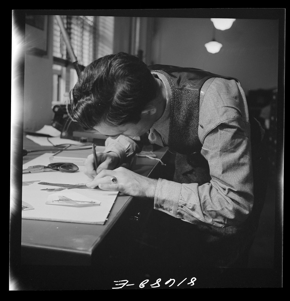 [Untitled photo, possibly related to: Washington, D.C. Preparing the defense bond sales photomural, to be installed in the…