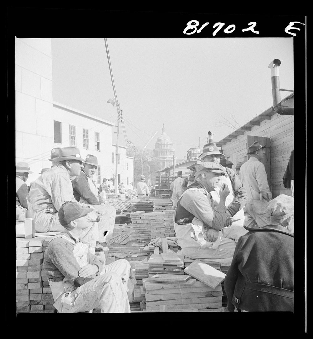 Washington, D.C. Workmen having lunch at a construction job undertaken to create emergency office space. Sourced from the…