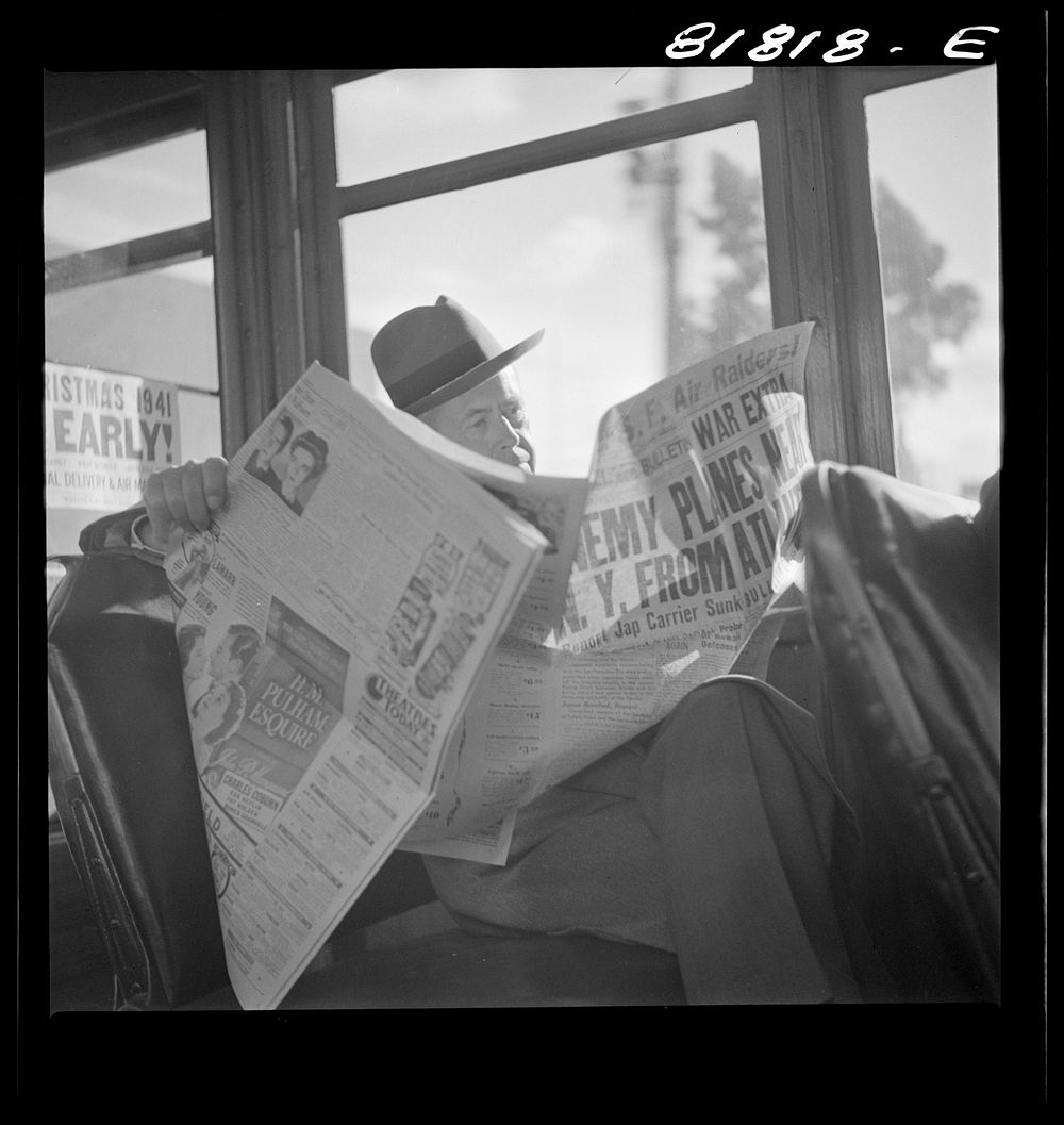 Reading war news aboard streetcar. San Francisco, California. Sourced from the Library of Congress.