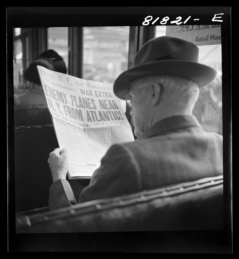 Reading war news aboard streetcar. San Francisco, California. Sourced from the Library of Congress.