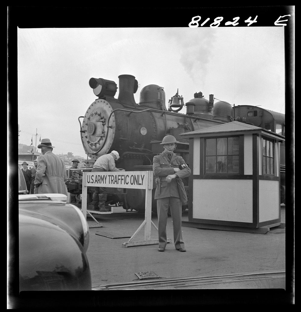 [Untitled photo, possibly related to: Army sentries standing guard at transport dock one day after the Japanese attack on…