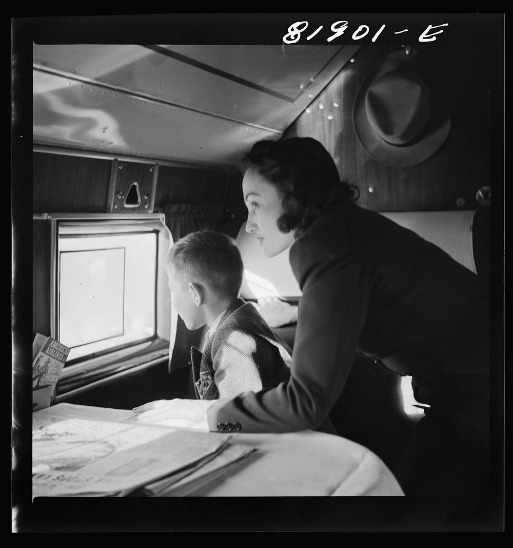 Passengers aboard an American airliner enroute from Washington to Los Angeles. Sourced from the Library of Congress.