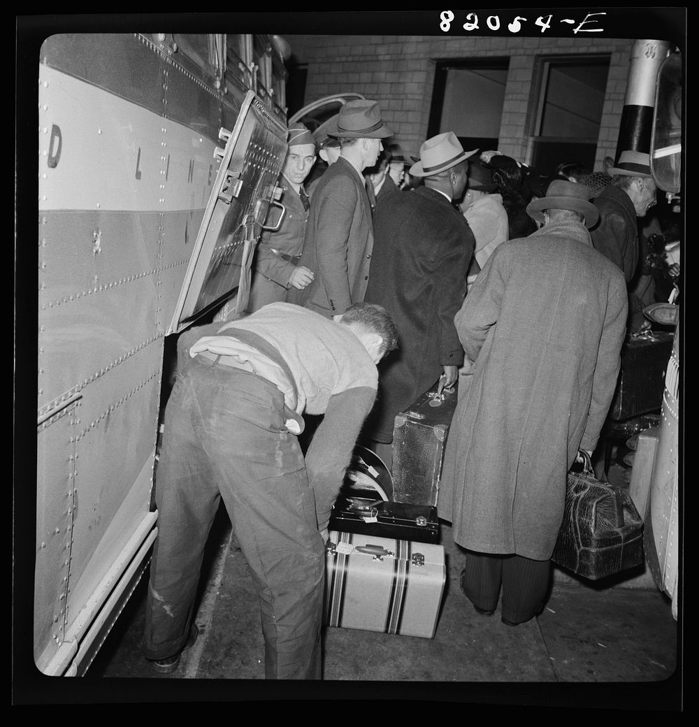 Washington, D.C. Christmas rush in the Greyhound bus terminal. Passengers leaving a bus. Sourced from the Library of…