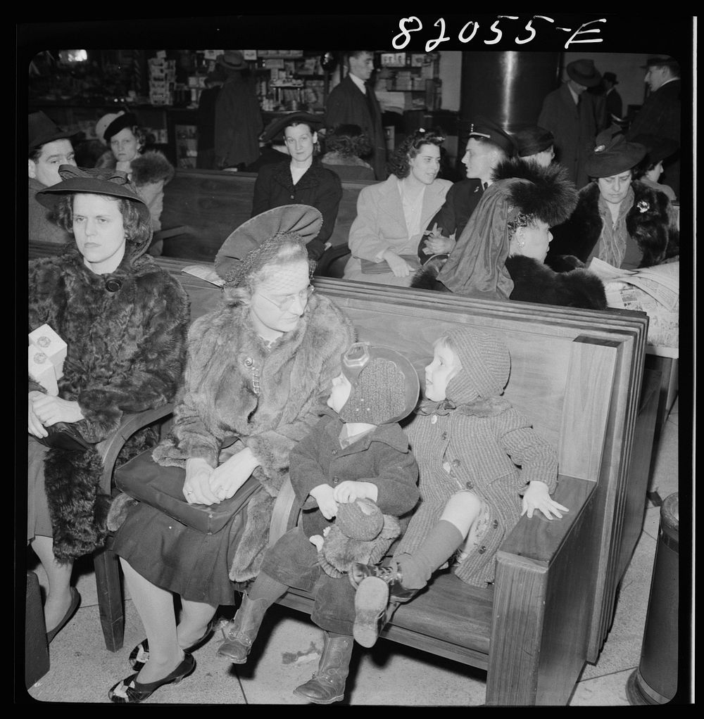 Washington, D.C. Christmas rush in the Greyhound bus terminal. Mother and children waiting for a bus. Sourced from the…
