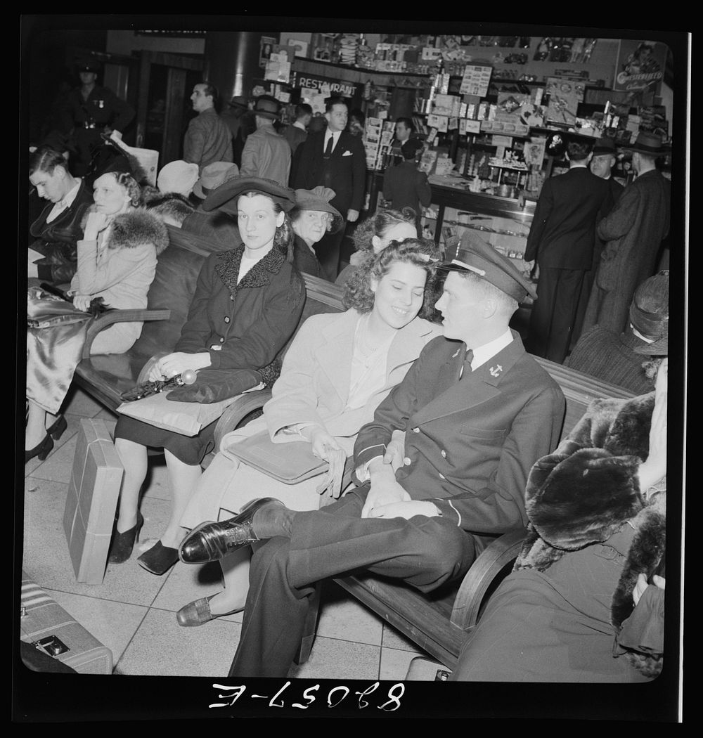 Washington, D.C. Christmas rush in the Greyhound bus terminal. Young lady and Naval officer. Sourced from the Library of…