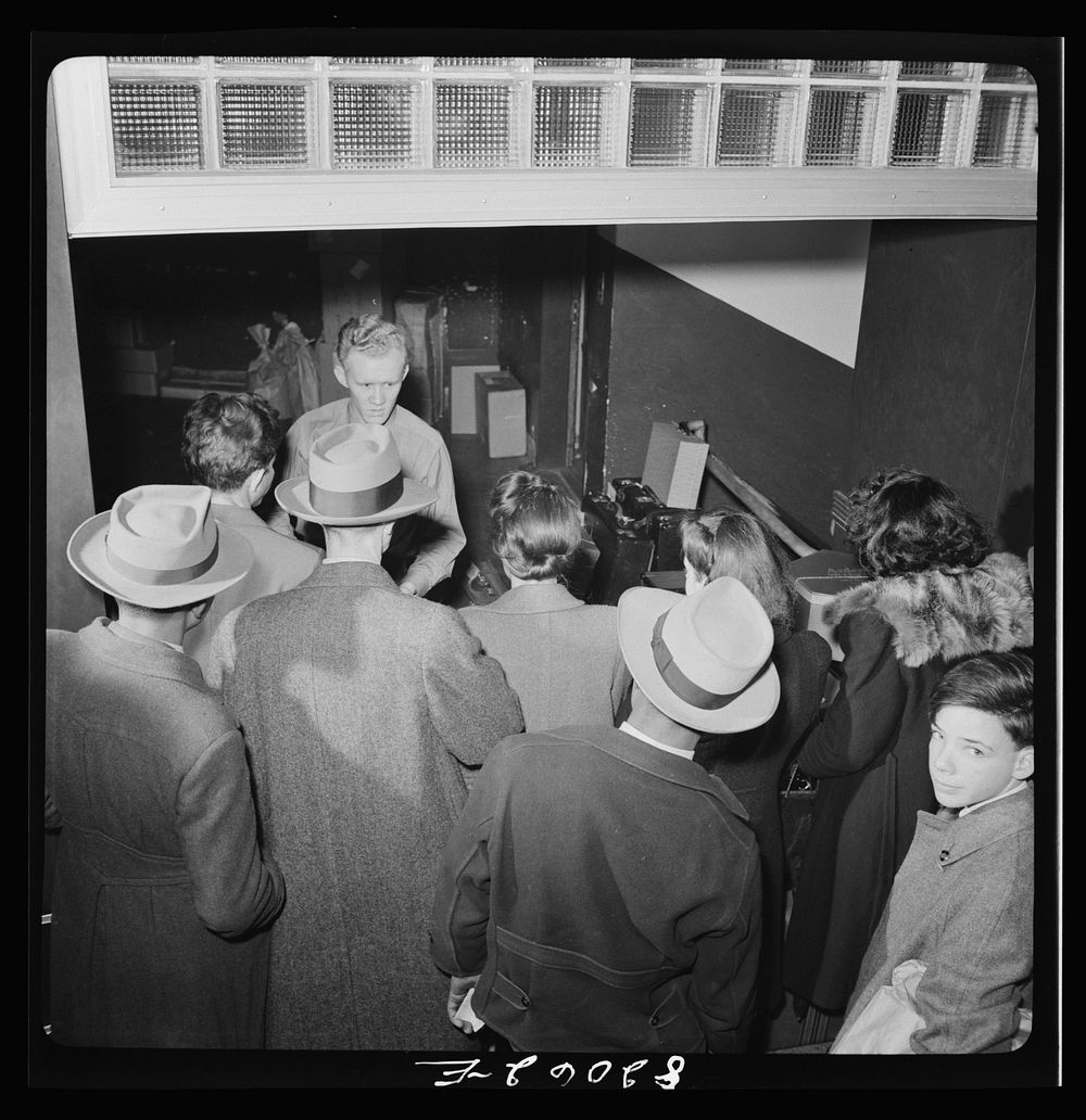 Washington, D.C. Christmas rush in the Greyhound bus terminal. Checking bags. Sourced from the Library of Congress.