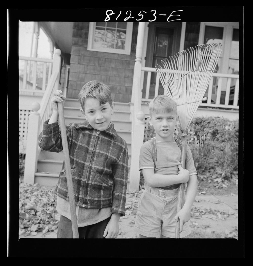 [Untitled photo, possibly related to: Little Falls, New York. Child raking autumn leaves in a small town]. Sourced from the…