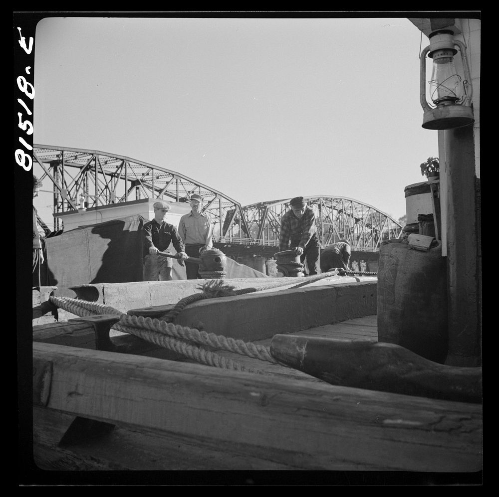 Barger being pulled through by winch, prior to picking up towline from tug. Erie Canal, New York. Sourced from the Library…