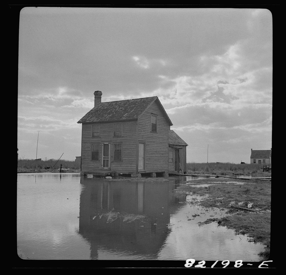 Dorchester County, Maryland. High tide sweeps under the floor of this "waterman's" home on Gibson Island. Sourced from the…