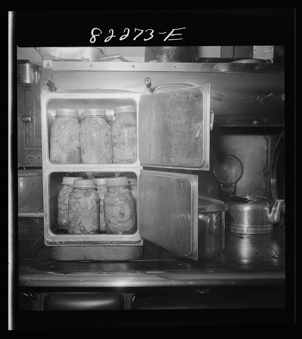 Honey Brook (vicinity) Pennsylvania. Cheap tin steamer used for cooking corned beef in home of Amish FSA (Farm Security…