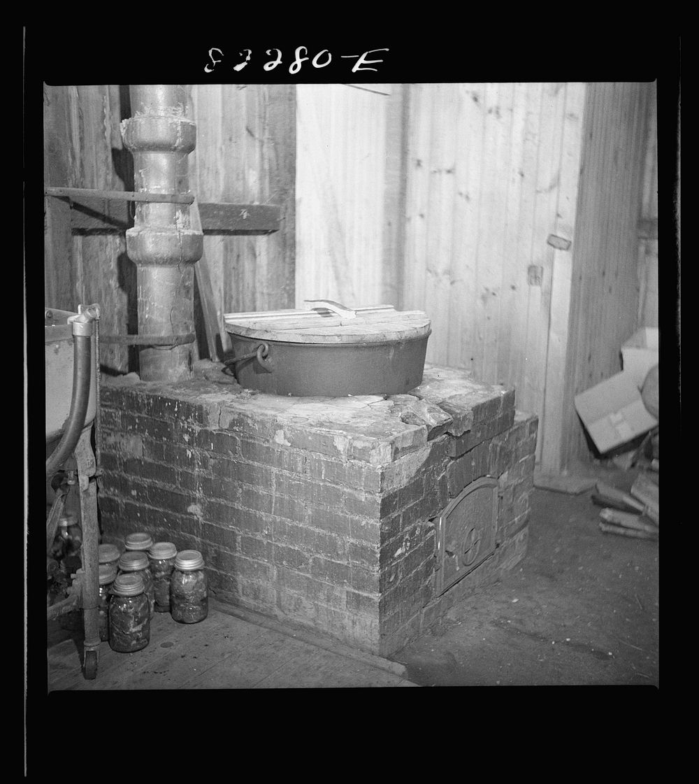 Honey Brook, Pennsylvania (vicinity). Dutch stove used for boiling down meat and bone scraps for soup jelly. Amish FSA (Farm…