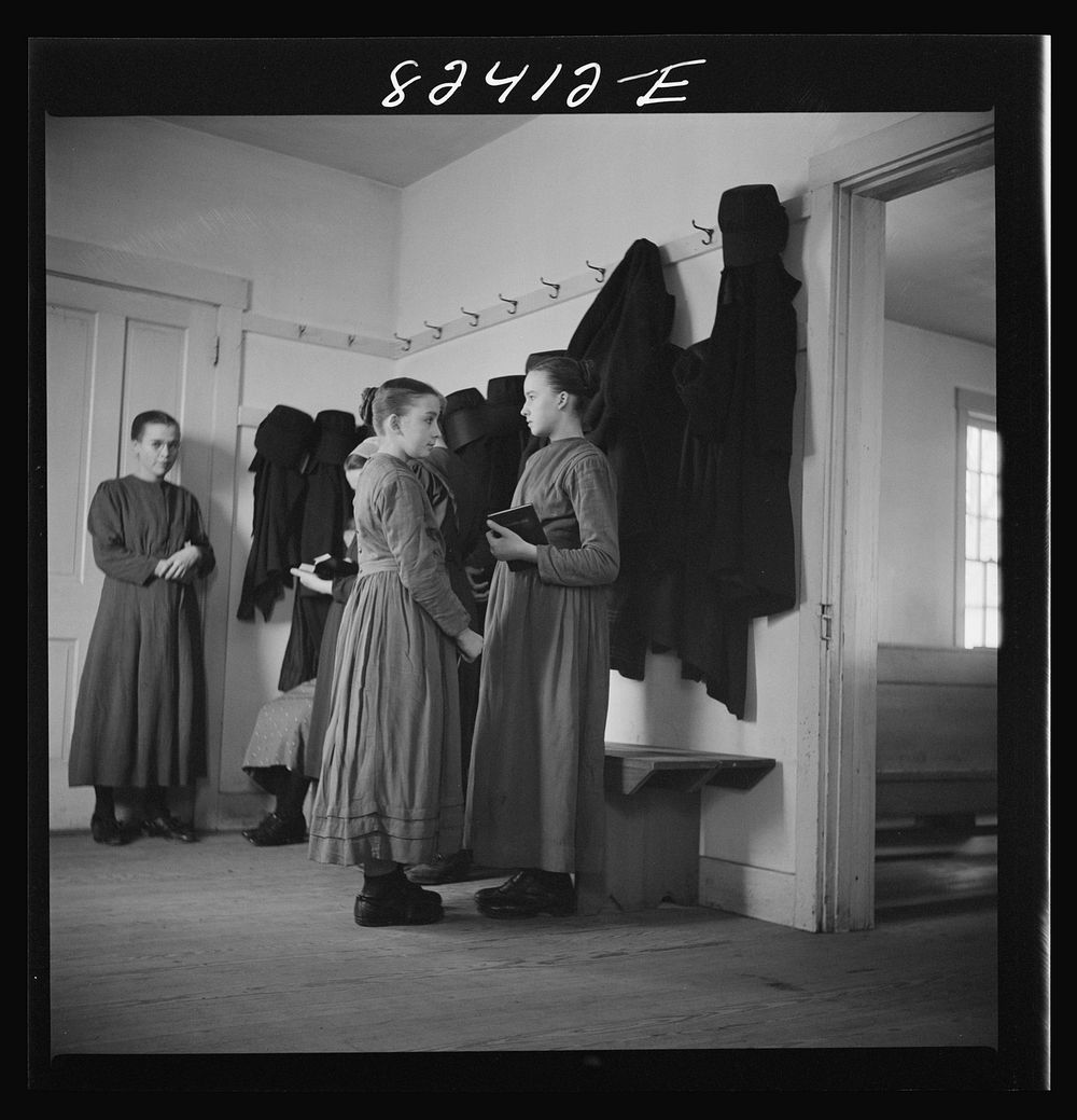 [Untitled photo, possibly related to: Hinkletown, Pennsylvania (vicinity). Mennonite girls waiting for "Deutsch school" to…