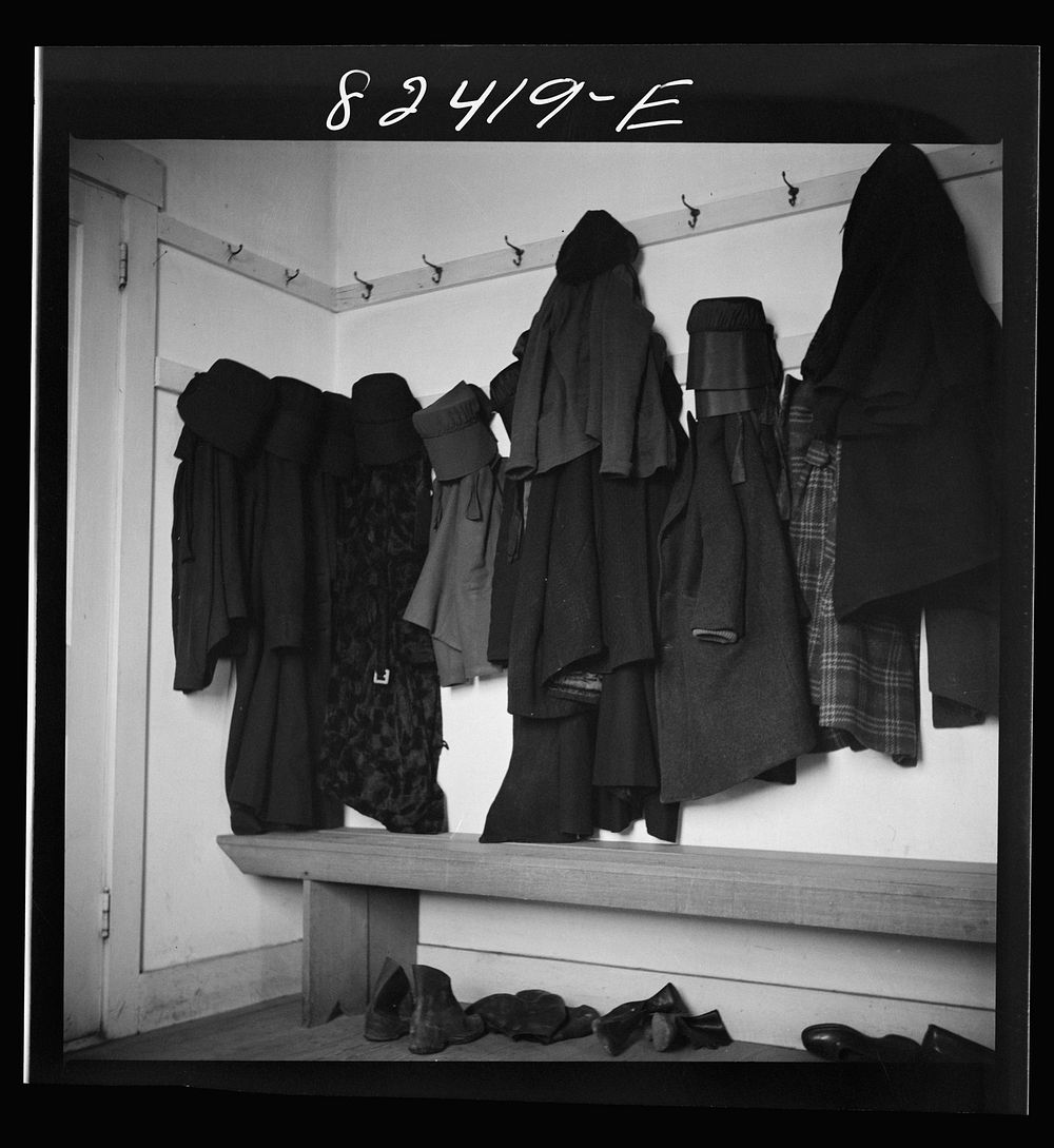 Hinkletown, Pennsylvania (vicinity). Girl's cloaks and bonnets hanging in church during "Deutsch school". Sourced from the…