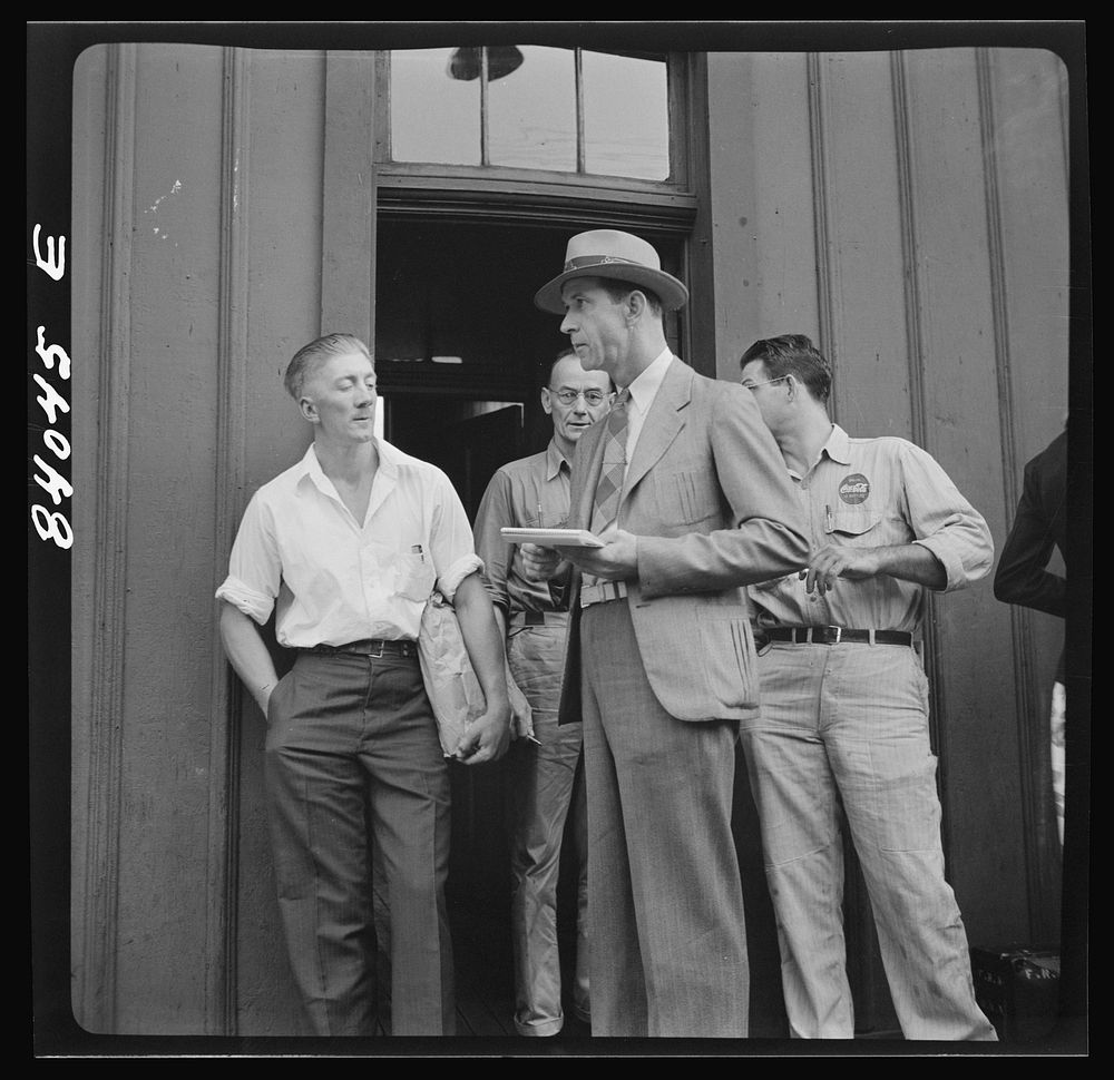 Richwood, West Virginia. United States employment agent checking off boys going to upper New York state to help in the…