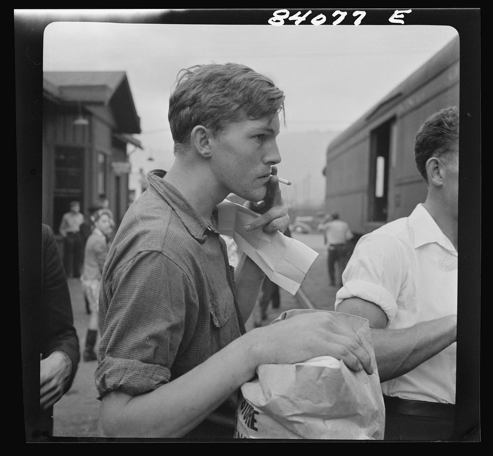 Richwood, West Virginia. Young man boarding train for New York state, where he will help in the harvest. Sourced from the…