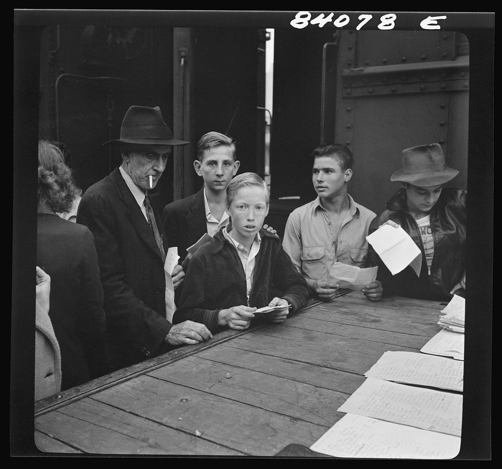 [Untitled photo, possibly related to: Richwood, West Virginia. Men and boys boarding train for Batavia, New York, where they…