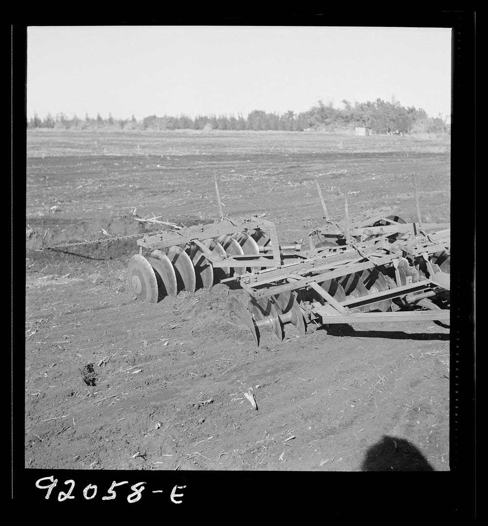 [Untitled photo, possibly related to: Sugarcane fields. Tractor-driven disc plough and harrow is used on many large flat…
