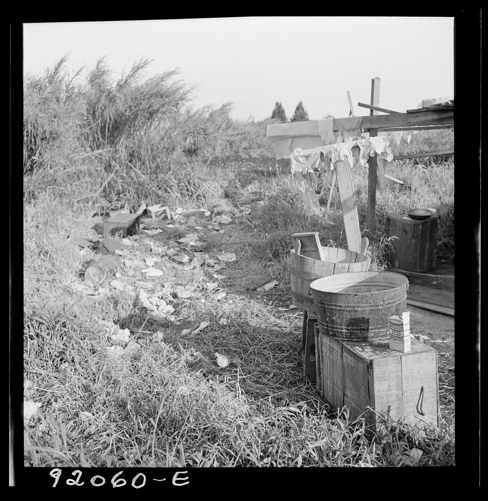 [Untitled photo, possibly related to: Migrant laborers camped beside a packinghouse in Belle Glade, Florida]. Sourced from…