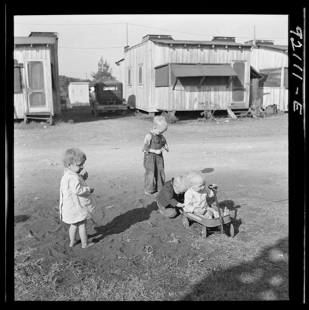 [Untitled photo, possibly related to:  Migrant laborers children living in overcrowded camps with very bad sanitary…