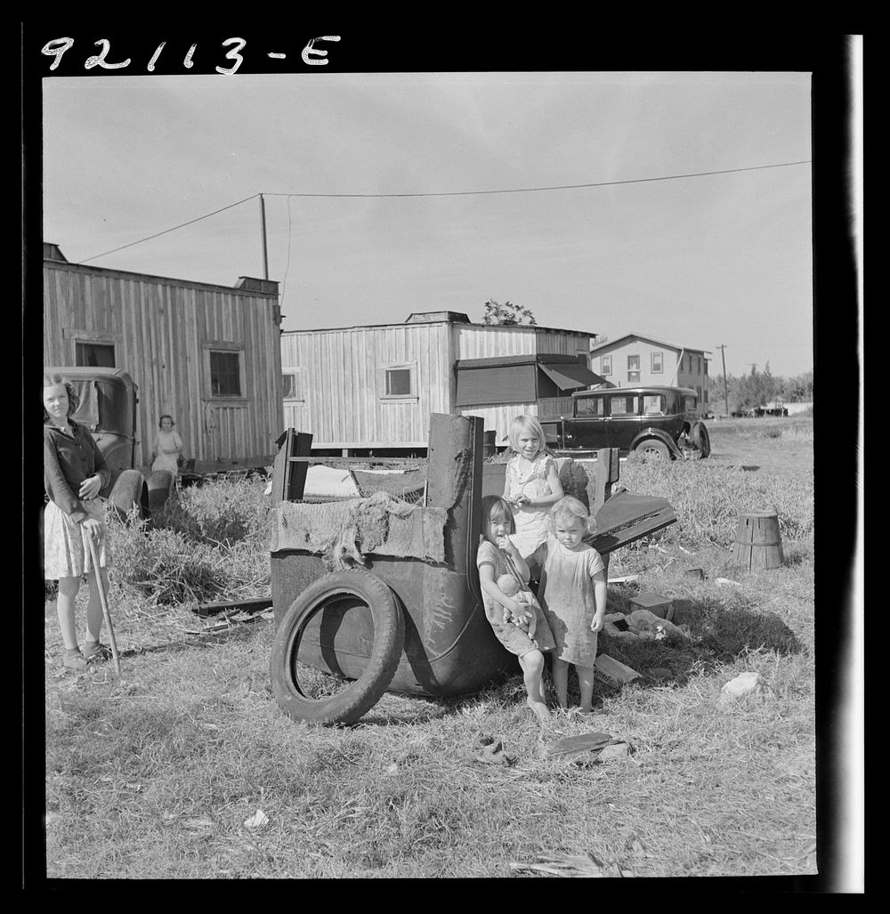 [Untitled photo, possibly related to: Migrant laborers children living in overcrowded camps with very bad sanitary…